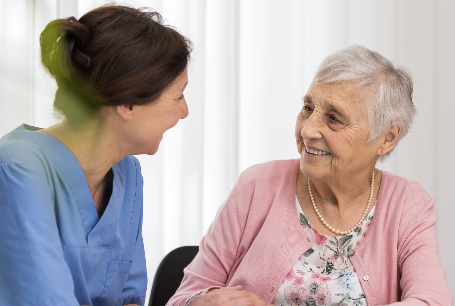 Care - senior woman with home caregiver