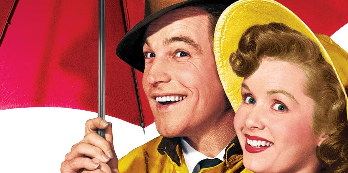 Gene Kelly Under His Umbrella, with a girl in his arms