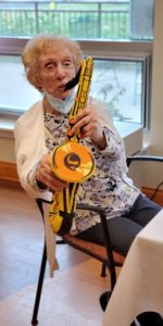 Elderly Lady playing a musical instrument
