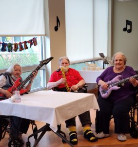 group of elderly people playing instruments